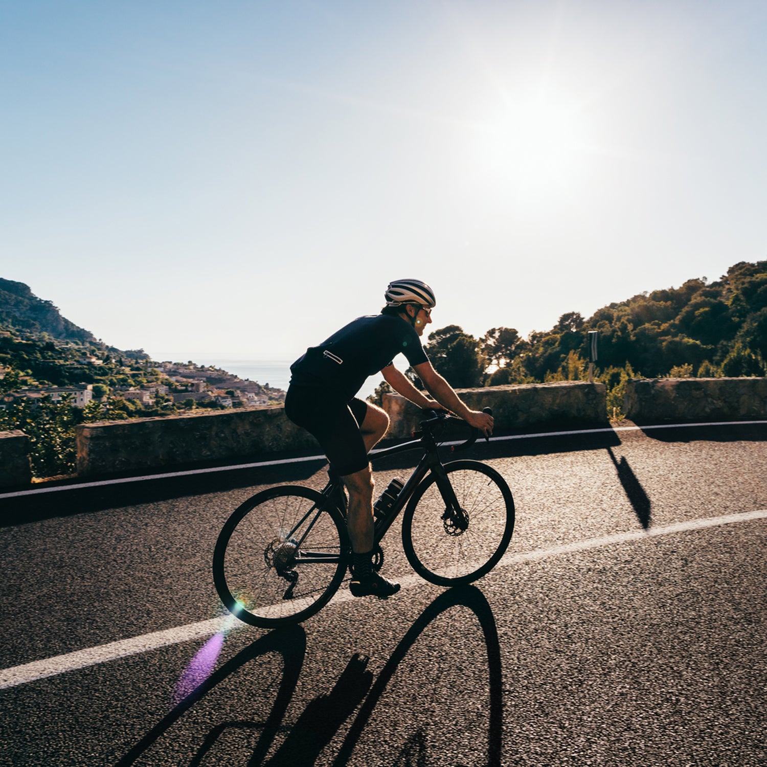 Cyclist riding on scenic road